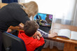 © sakkmesterke - Mother turning off computer for computer addicted little gamer kid