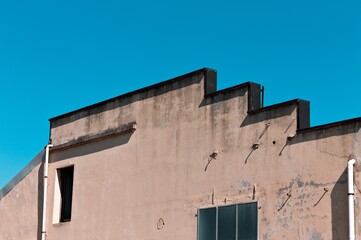 Wall Mural - A particular roof of an old building with rectangular windows (Pesaro, Italy, Europe)