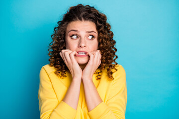 Wall Mural - Close-up portrait of her she nice attractive afraid worried guilty wavy-haired girl waiting expecting bad news looking aside biting nails isolated over bright vivid shine vibrant blue color background