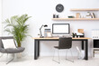 © New Africa - Modern computer on table in office interior. Stylish workplace