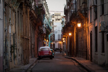 Amazing Old American Car On Streets Of Havana With Colourful Buildings In Background. Havana, Cuba.