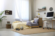 © New Africa - Stylish teenager's room interior with comfortable bed and workplace