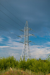 High-voltage support against a stormy sky