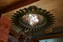 Beautifully Decorated Bottle Chandelier In A Bar Or Restaurant.