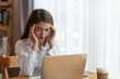 © surachetkhamsuk - Stressed business woman with palm on face in her office