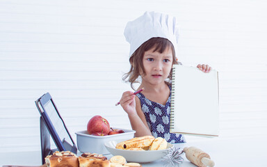 A little girl is making bakery