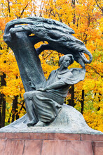WARSAW, POLAND - OCTOBER 26, 2016: Fryderyk Chopin Monument In Autumn Scenery Of The Royal Lazienki Park In Warsaw, Poland, Designed Around 1904 By Waclaw Szymanowski (1859-1930).