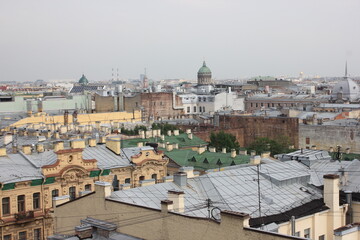 Saint-Petersburg, Russia - 10.06.20. Cityscape panorama of old central city part, view from a roof. Famous rooftops of St. Petersburg with Saint Isaac's Cathedralat the background.