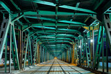 Fototapeta Most - Illuminated green metal bridge