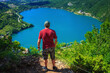Scanno lake, Italy. Heart-shaped lake. Famous heart-shaped lake in the Abruzzo National Park in Italy. Hiker observes the landscape from the summit with the lake below.