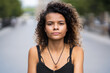 © SYCprod - Portrait of mixed race girl looking at camera in the street