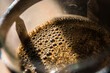© Stephen - Close up of fresh coffee bubbles in a french press (sometimes called a cafetiere) in sunlight.