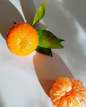 Two Mandarins On A Table