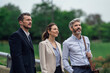 © PhotoAlto - Businesspeople talking in public park