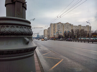 A sign with a QR code for a traffic light in Moscow, against a rainy road-Varshavskoe highway