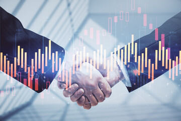 Double exposure of forex graph hologram and handshake of two men. Stock market concept.