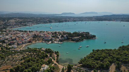 Aerial drone photo of famous fjord seaside village and bay of Porto Heli in the heart of Argolida prefecture, Peloponnese, Greece