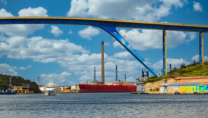Fototapete - Boats and Heavy Industry at Curacao Harbor
