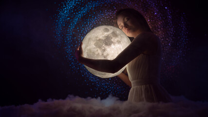 Wall Mural - sensitivity and the universe, astrology and space, a girl holding the moon in her hands, fairy tale 