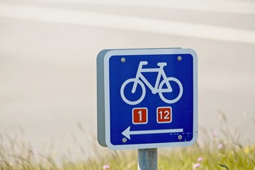 signs with the text bike path 1 and 2 kilometer