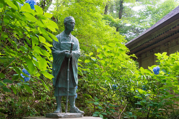 Matsuo Basho Monument at Chusonji Temple in Hiraizumi, Iwate, Japan. Matsuo Basho (1644-1694) was the most famous poet of the Edo period in Japan.