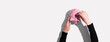 Leinwandbild Motiv Person depositing money in a pink piggy bank