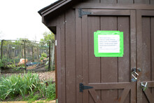 Shed At Community Garden With Sign