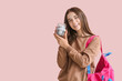 © Pixel-Shot - Teenage girl with savings for education on color background