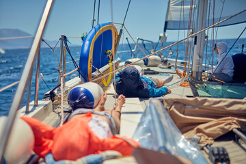 Wall Mural - Summertime cruising enjoying on a sailing boat at open sea.