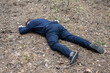 © Petr - Murder in the woods. The body of a man in a blue shirt and trousers lies on the ground among the trees in the forest. Victim of an attack.