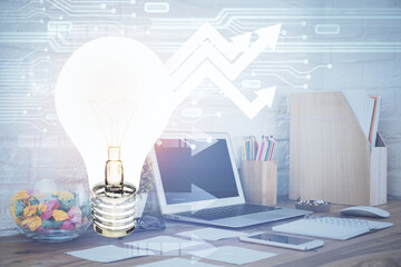 Aufkleber - Computer on desktop in office with bulb icon hologram. Double exposure. Concept of idea.