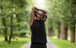 © Prostock-studio - Smiling black sportsman enjoying exercising at park