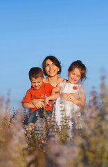 Wall Mural - mother hugging laughing kids