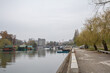 Panorama of the Tamis river, on Pancevo Waterfront in the center of the city, during a cloudy afternoon. Iconic silos are visible in background. Pancevo, Serbia, is one of the biggest cities of banat
