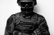 © Vladibulgakov - SWAT in black uniform, face mask and bulletproof vest. Tactical helmet vest goggles. Spec ops Riot police officer Defense and protection of law enforcement officers. black and white photo