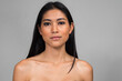 © Ranta Images - Portrait of young beautiful Asian woman shirtless