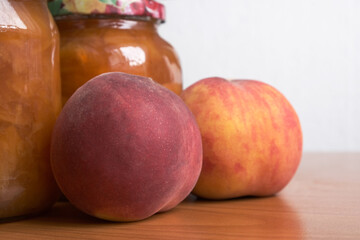 Ripe sweet whole peaches and jam