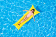 © New Africa - Cute little girl with inflatable mattress in swimming pool, top view. Summer vacation