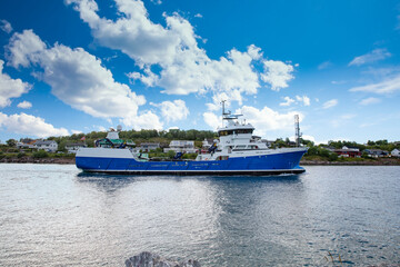 Fish farming boat through Bronnoysundet, Nordland county