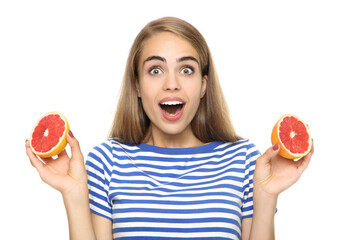 Young girl with fresh grapefruit on white background