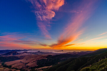 Wall Mural - Sunset in the Mountains with Colorful Clouds