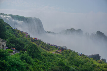 Wall Mural - Niagara Falls, NY: Tourists climb the stairs on Prospect Point to get a close up view of the American Falls.