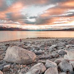 Wall Mural - Girl on Rocky Beaching looking at Mount Cook