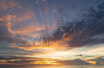 Wall Mural - abstract amazing scene of stuning colorful sunset with clouds background in nature and travel concep