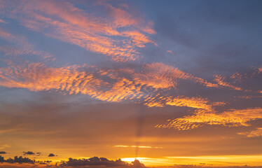 Wall Mural - abstract amazing scene of stuning colorful sunset with clouds background in nature and travel concep