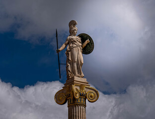 Athena, the ancient Greek goddess of wisdom and knowledge under impressive sky, Athens Greece