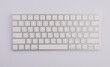 © apinya - Modern aluminum computer keyboard isolated on white background.