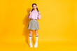 © deagreez - Full length photo sweet lovely girl hold tails look copyspace think thouhts guess imagine her date plans send air kiss wear jumper plaid clothes isolated bright shine color background