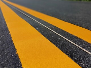 Wall Mural - Yellow traffic line color For the safety of traveling