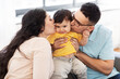© Syda Productions - family and people concept - happy mother and father kissing baby son at home